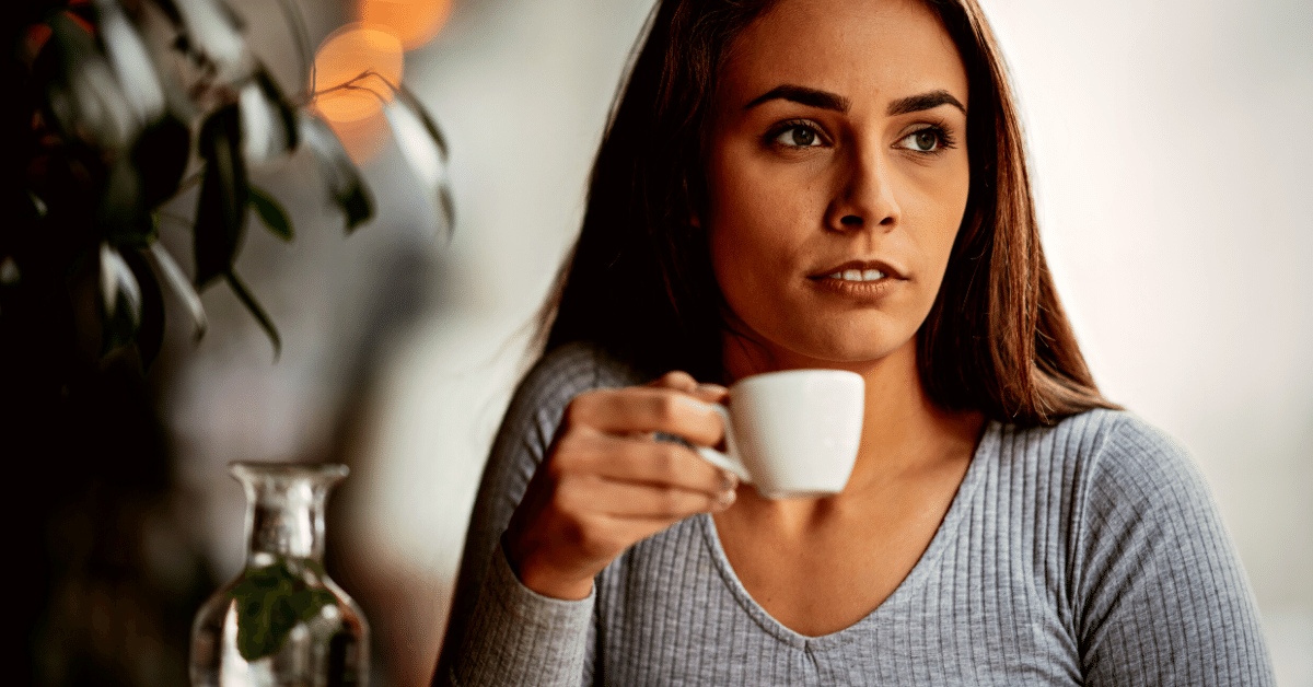 Woman enjoying an espresso drink
